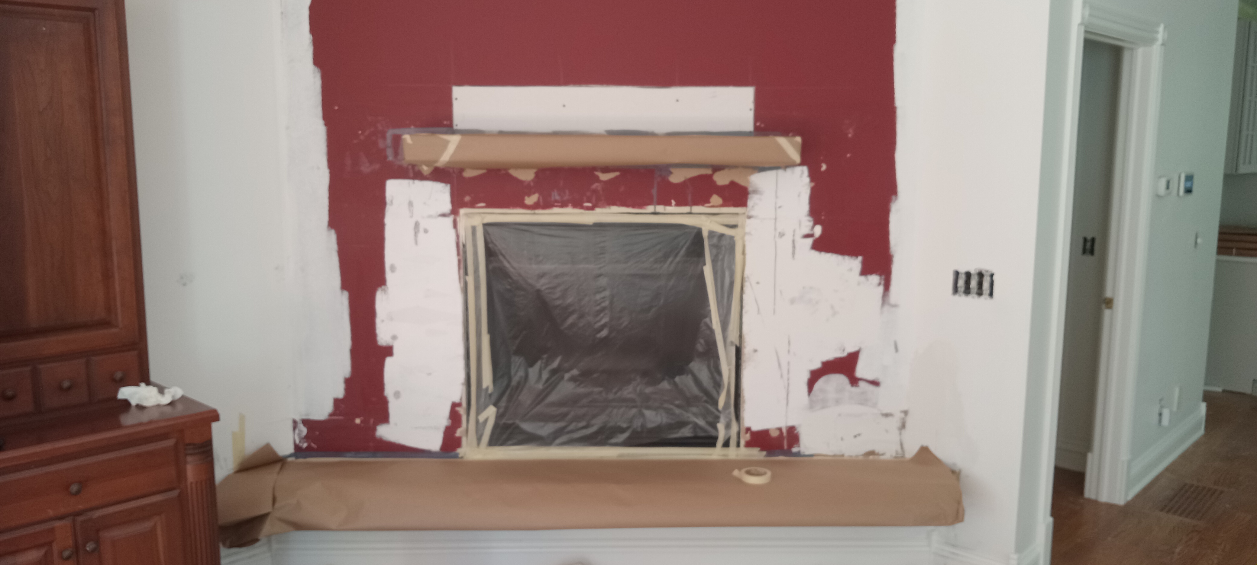 Fireplace before — red wall