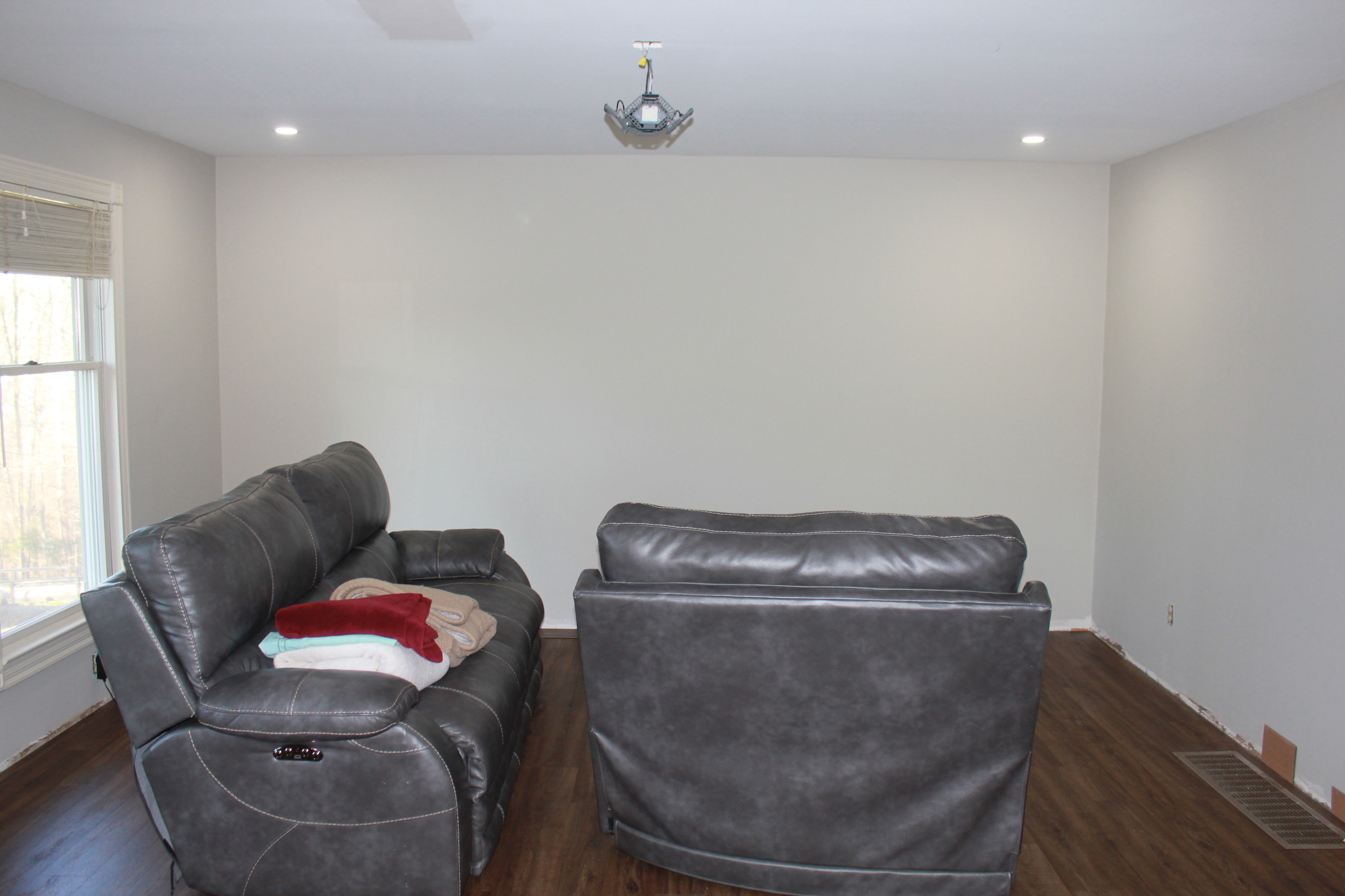 Living room before — fireplace wall